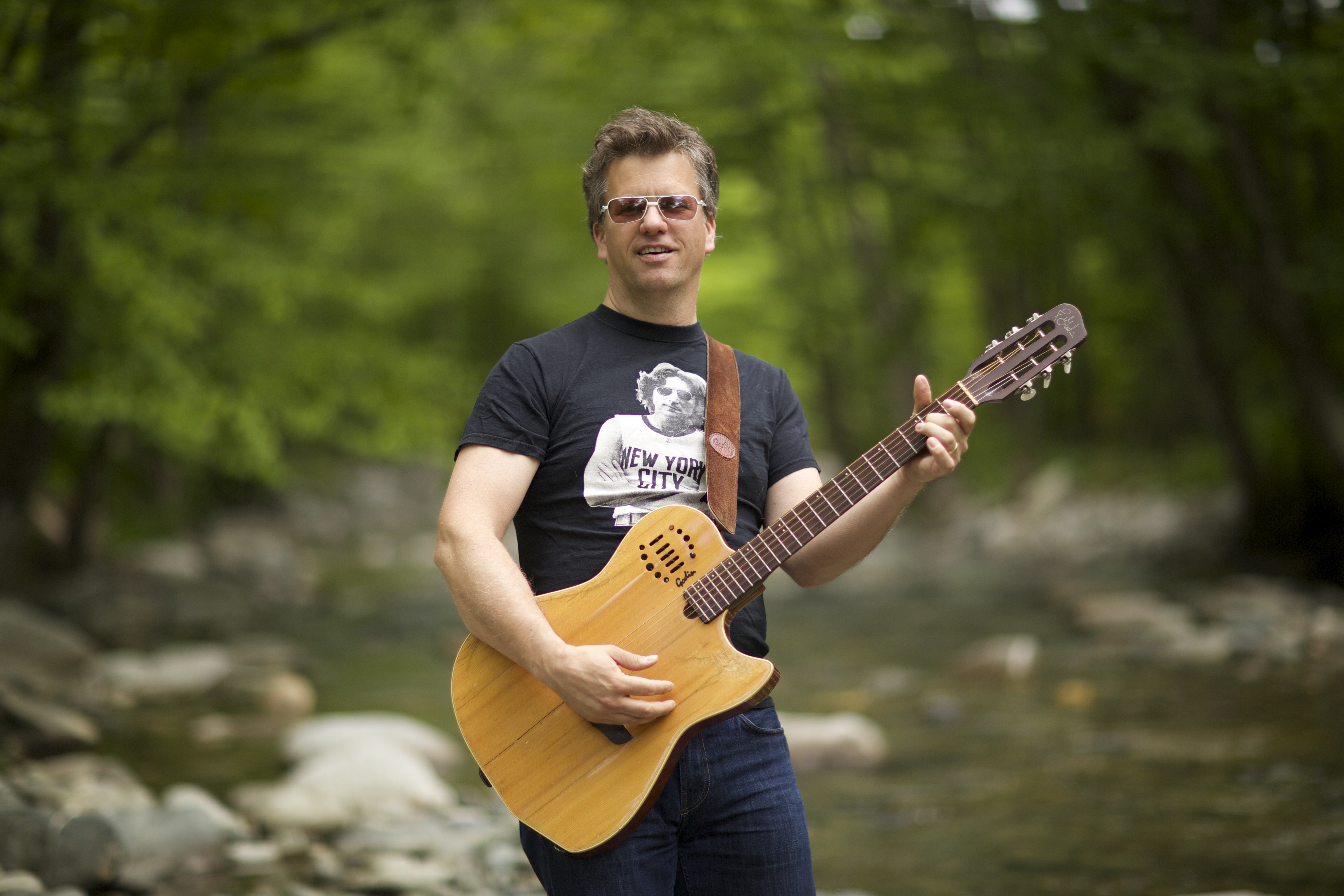 Chad Hollister performing acoustic guitar